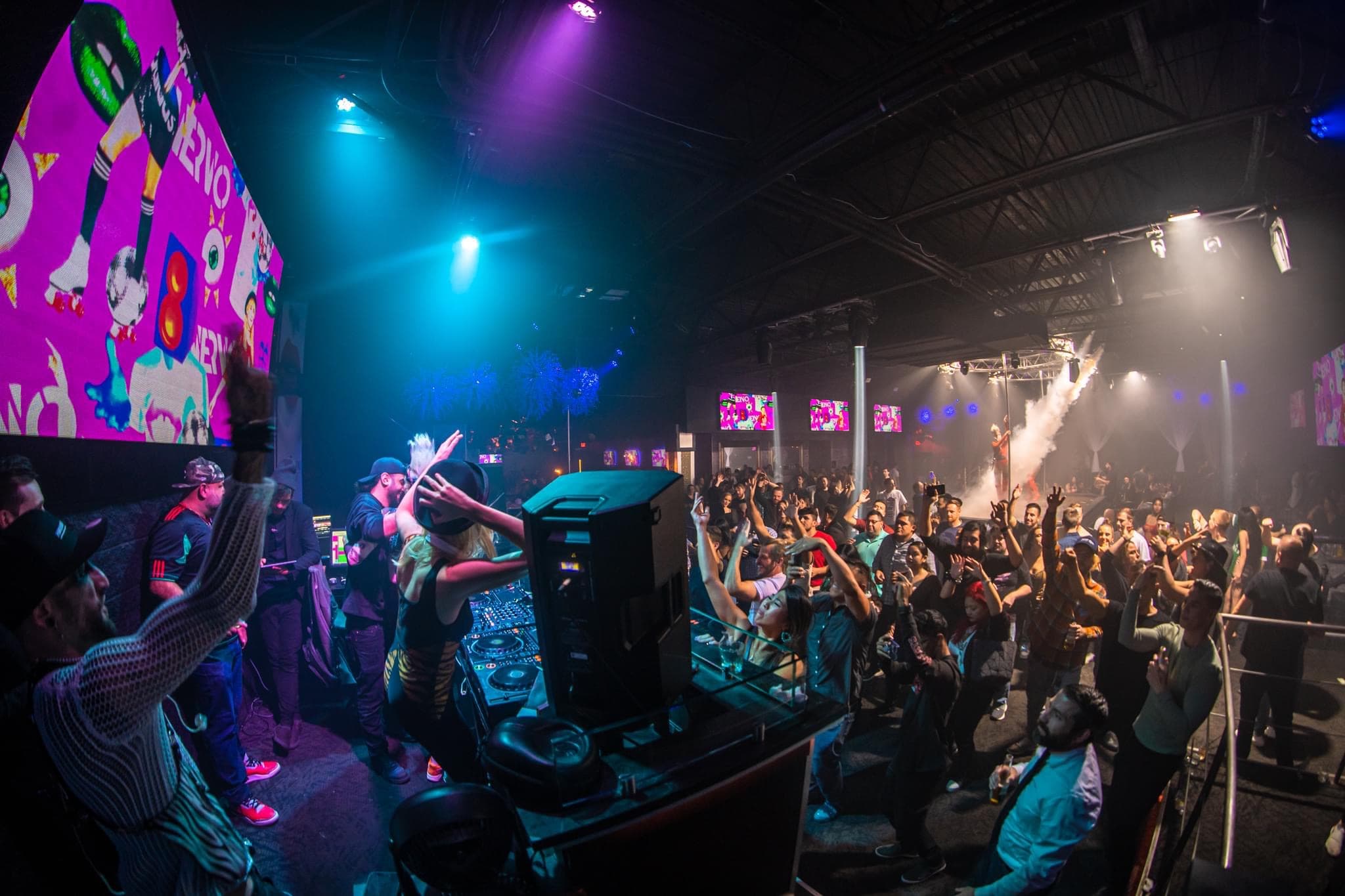 DJ performing to a full house in front of the LED wall at The Gold Room Chicago