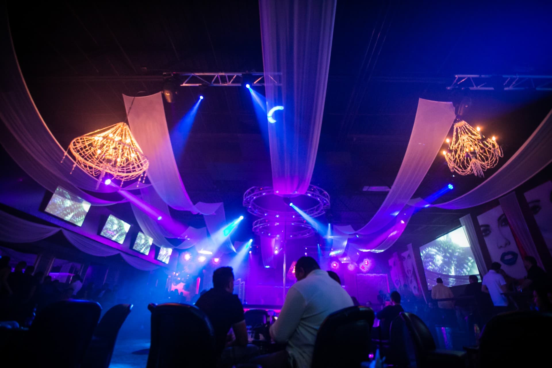 Overhead truss, chandeliers and moving lights above the main stage at The Gold Room Chicago
